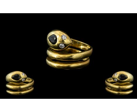 18ct Gold Snake Ring, in the form of a serpent with sapphire head and diamond eyes.  Weight 10 grams.  Ring size K.