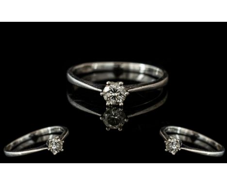 Platinum Single Stone Diamond Ring, set with a round modern brilliant cut diamond, claw set, fully hallmarked.  Ring size L.