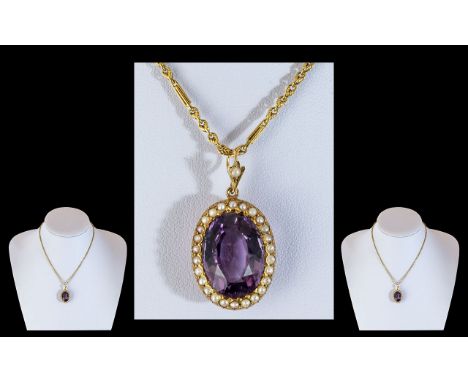 An Antique 15ct Gold Amethyst and Seed Pearl Pendant, large central amethyst approx. 20 x 15 ml, surrounded by sea pearls.  H