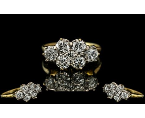 A Diamond Cluster Ring set with six round cut diamonds, approx 30 pts each, and a centre diamond approx. 10 pts. Estimated di