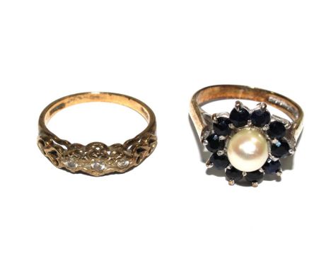 A 1930s three stone diamond ring set in 9 carat gold, a pearl and sapphire cluster ring set in 9 carat gold 