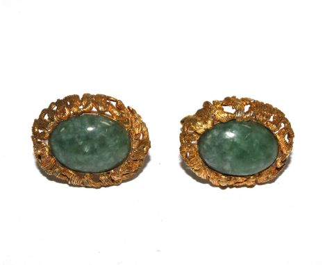 A pair of 18 carat gold cufflinks set with cabochon jade 