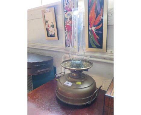 A brass oil lamp with low squat reservoir, Veritas Lamp works, 44 cm high