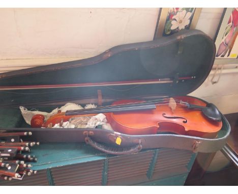 A violin, with two piece back and labelled H. Emile Blondelet, luthier a Paris, length of back 35.5 cm, and a bow stamped Ste