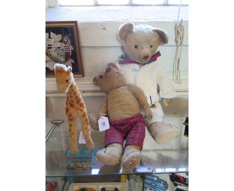 A Steiff giraffe figure, with button to ear, 27 cm high, and two teddy bears (3) 