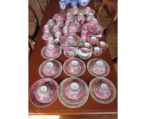 A Chinese dinner service with pink enamel, including bowls, plates, dishes, serving ware and tea cups 