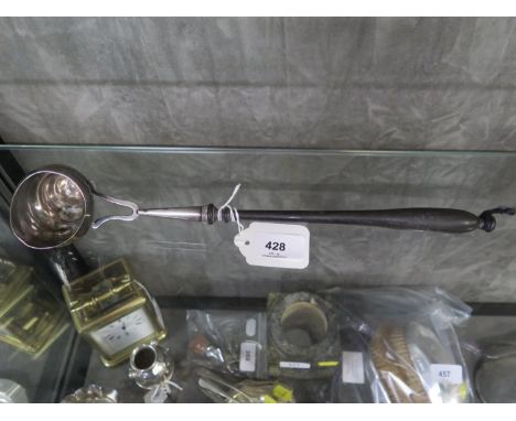 A Continental punch ladle, the bowl in the form of a shell and finished in white metal 