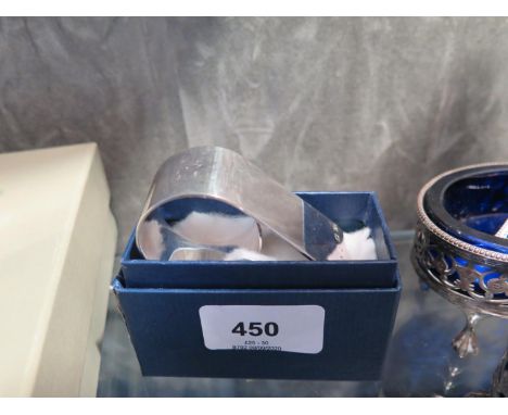 A heavy silver napkin ring, boxed 