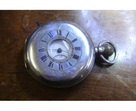 POCKET WATCH - A Chester silver cased half hunter pocket watch with enamel dial, Roman numeral markers & subsidiary seconds d