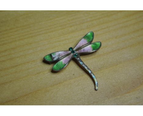 SILVER & ENAMEL DRAGONFLY BROOCH: A hallmarked silver brooch in the form of a dragonfly, enamelled in green & pink. Measure a