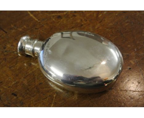 SILVER OVAL HIP FLASK: A solid silver oval form hip flask. Missing stopper/lid.  Hallmarked for Birmingham 1915. Measures app