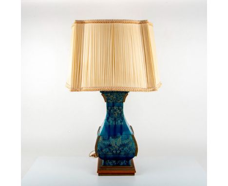 A beautiful large blue lamp adorn with Asian motif reliefs and carvings. Includes a cream-color lamp shade. Dimensions: 24.25