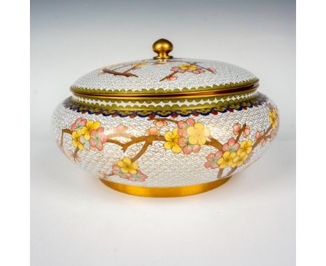 A brass and white enamel bowl decorated with pink and yellow cherry blossoms. Dimensions: 10"W x 5.75"HCountry of Origin: Chi