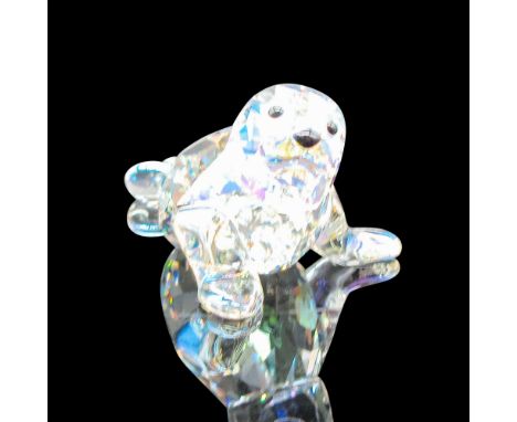 Clear faceted head, body with smooth fins, black eyes and nose. Swarovski backstamp. 1096748. This item has its original box: