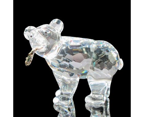 Clear faceted crystal body with black inset eyes holding a salmon fish. Swarovski backstamp. 7637000007. This item has its or