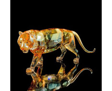 Shimmers in fully facetted golden shine crystal with satin crystal stripes; padparadscha crystal nose and moroda crystal eyes