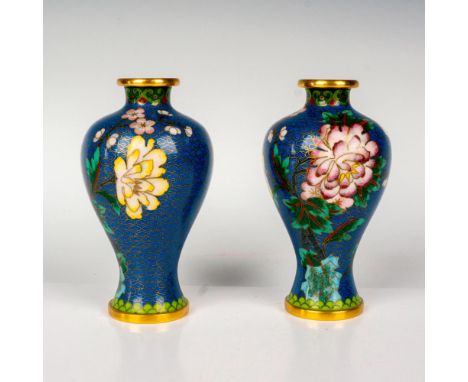 2 small plum-shaped vases in a blue enamel ground. Decorated in an enamel colorful floral branches with brass accents. Dimens
