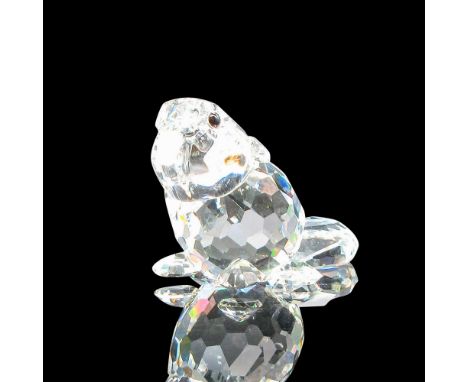 Part of the Endangered Species group. Clear crystal figural with tail flat, black eyes and frosted teeth. Swarovski backstamp