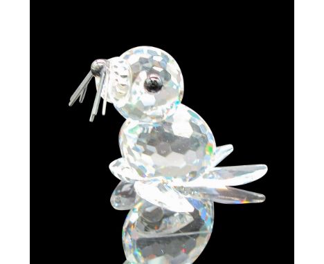 Clear faceted body with black crystal eyes, black nose and black whiskers. Swarovski backstamp. This item has its original bo