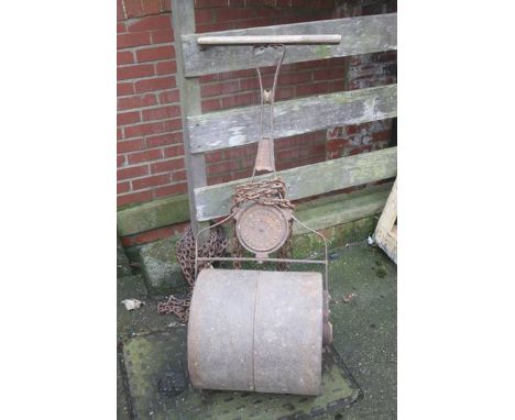 A cast iron garden roller