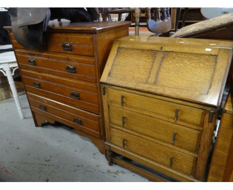 VINTAGE LIGHT OAK BUREAU with three drawers on raised feet, together with a stained pine chest of drawers 