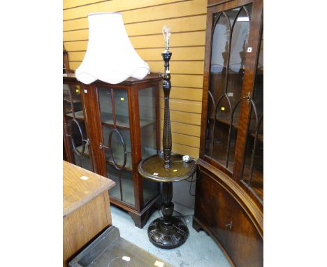 REPRODUCTION OAK STANDARD LAMP with circular shelf and carved wood base