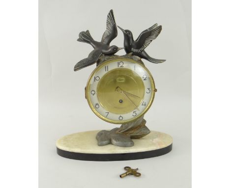 FRENCH DECORATIVE MANTEL CLOCK on oval marble base, spelter mounted with two doves to the top, circular dial inscribed 'silve
