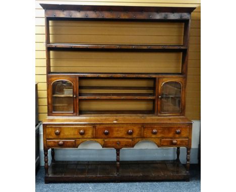 19TH CENTURY SWANSEA WELSH DRESSER, open platform boarded-shelf base, six turned supports, five base drawers, single centre d