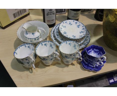 Two Foley china blue and white teacups and saucers, porcelain part tea service, decorated with turquoise floral sprays 