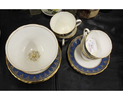 New Chelsea Staffordshire part tea service, the blue mottled ground with gilt scroll decoration, comprising four tea cups, fo