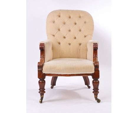 Victorian mahogany armchair, with cream upholstered button back, scrolled arms, on reeded turned legs and castors