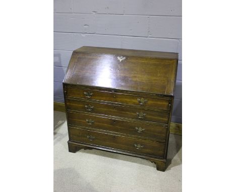 19th Century mahogany bureau, the fall opening to reveal a fitted interior and green leather writing surface, above four long