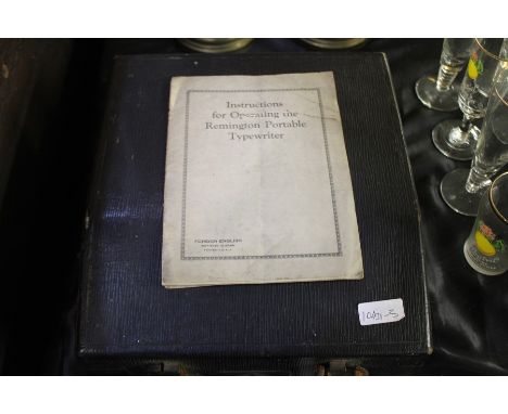 Remington portable typewriter, with original instruction manaul, housed in a black travelling case