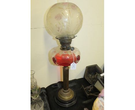 Edwardian oil lamp, with frosted foliate shade above a clear and mottled glass reservoir, raised on a reeded brass stem, gadr