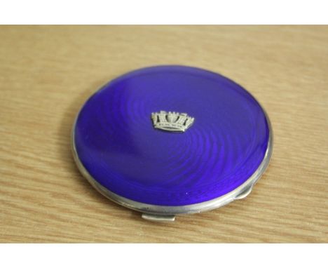 George V silver powder compact, Birmingham 1934, maker Gieves Ltd, the blue swirled enamel exterior with crown to the centre,