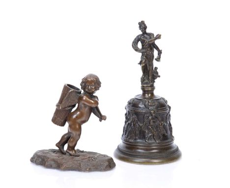 Bronze Italianate bell18cm, and a bronze spill holder in the form of a cupid carrying a basket, 10cm x 11cm high (2)Condition
