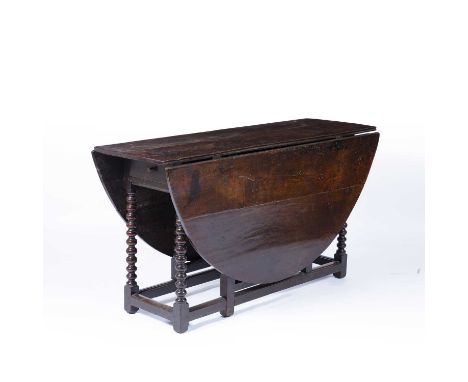 Large oak gateleg dining tablewith drawer and on carved bobbin supports, 147cm x 170cm x 79cmCondition report: Some cracks, m