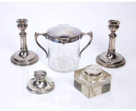 Glass and silver topped square inkwell9cm across, a further inkwell 10cm, a pair of plated candlesticks and a glass and silve