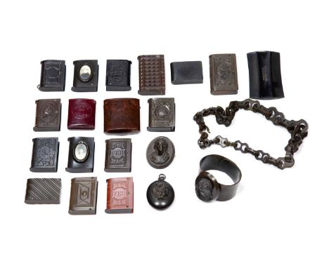 Collection of vulcaniteto include seventeen vesta cases of varying styles and different motifs, a cameo broach, a bangle with