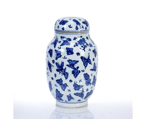 Blue and white porcelain vase and coverChinese, of ovoid form, decorated all over with scattered butterflies and four symboli