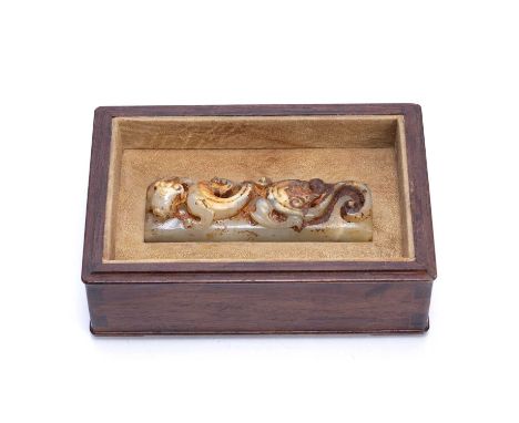 Jade scroll weightChinese, carved with to chi-lin dragons, with two character mark to the underside, in a line hardwood case 