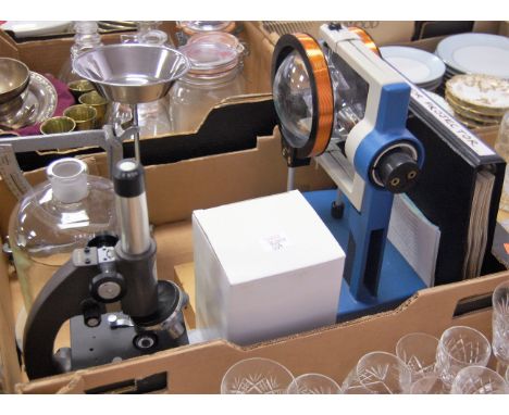 A box of scientific equipment to include student's microscope, scales, etc