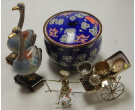 A Chinese white metal model of a street vendor with cart, together with a pair of cloisonné enamel swan ornaments, and a Chin