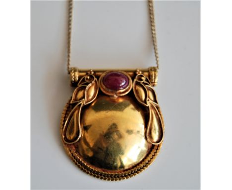 An Eastern gold and ruby pendant necklace, the round disc style pendant, 3cm diameter, (unmarked, tests as approx. 22ct, appr
