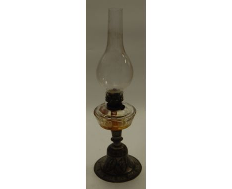 A circa 1900 North African stippled engraved metal pedestal oil lamp (lacking shade, and possibly converted from a hookah pip