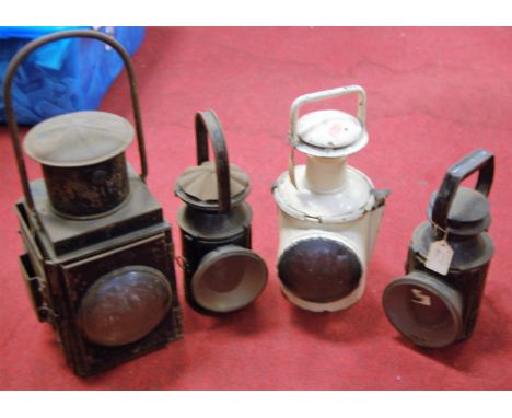 A **mid 20th century black painted railway signal lantern together with four other hand lanterns** (5) 