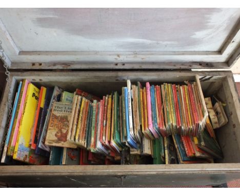 A trunk containing Ladybird and other childrens books and games