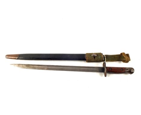 A 1907 model bayonet and scabbard with webbing frog.  This bayonet is by Remington (the rarest maker of the 1907 model) with 