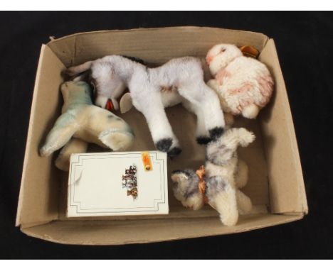 A boxed original Steiff miniature Teddy 1985 and Robby seal, Grissy Donkey, Kitty Kitten and one other unboxed