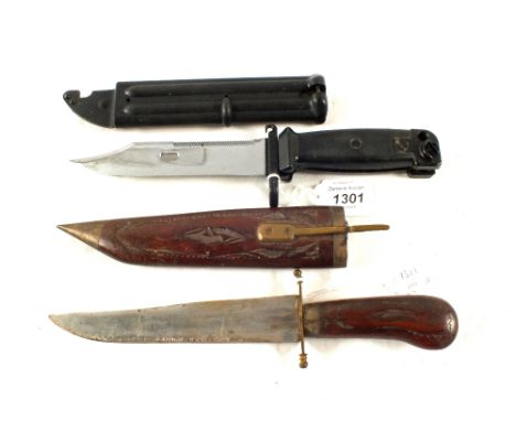 An AKM bayonet with scabbard and a Indian decorative dagger